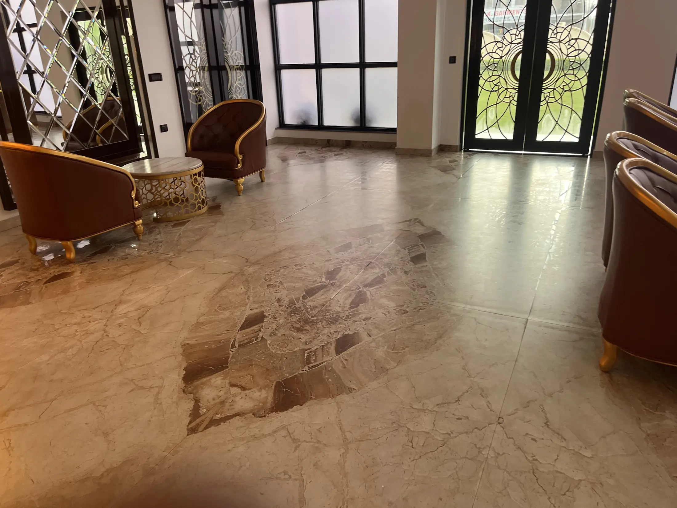 Stone floor and lounge seating in an Amsterdam residence