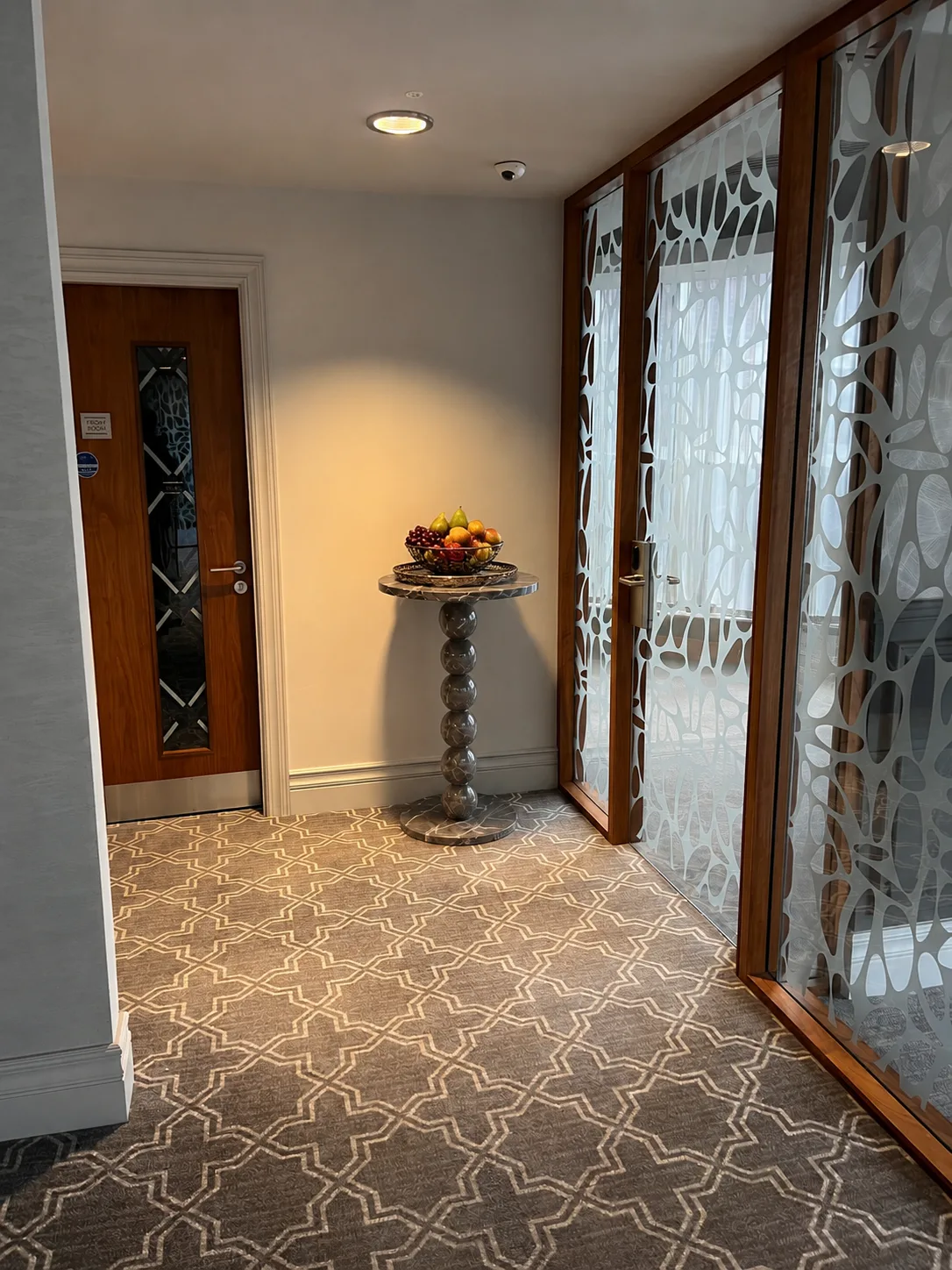 Marble pedestal side table at P4 Fertility Clinic